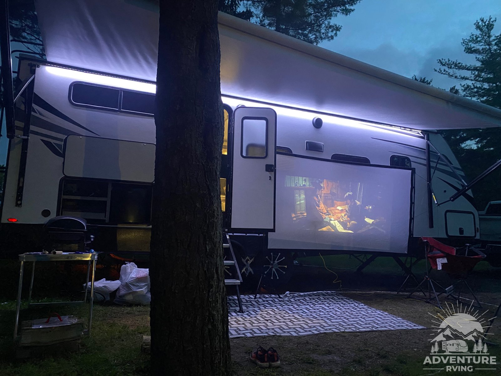 Watching movie at campfire at Jellystone Bear Campground